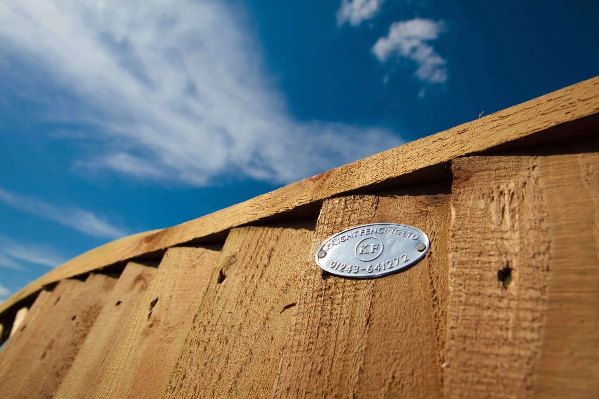 Fence panel with Knight Fencing badge on showing that Knight Fencing are Commercial Fencing Contractors in Chichester