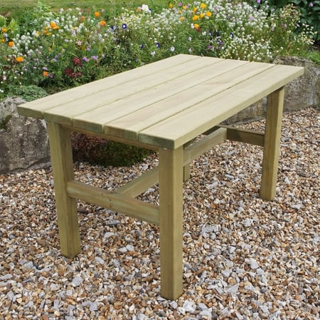 Wooden garden table on gravel