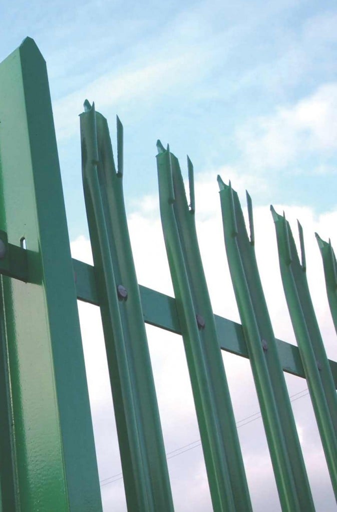 A photo of a steel palisade fencing in green steel