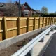 Photo of Timber closeboard fencing and armco barrier installed by Knight Fencing at Salisbury Railway Station