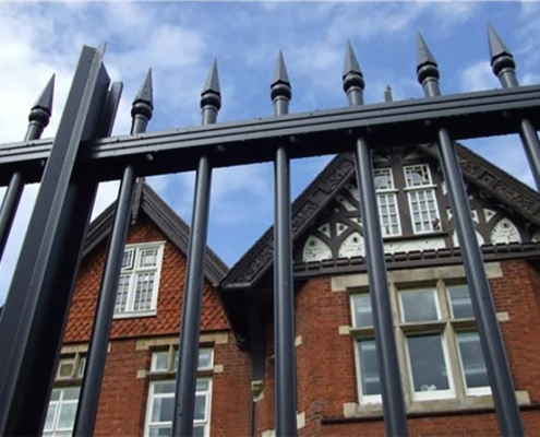 Heras Contour TR300 Finial Railings installed around a building