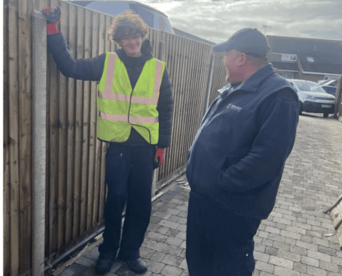Work experience student Joey and Shane from Knight Fencing at a timber fencing site in Chichester