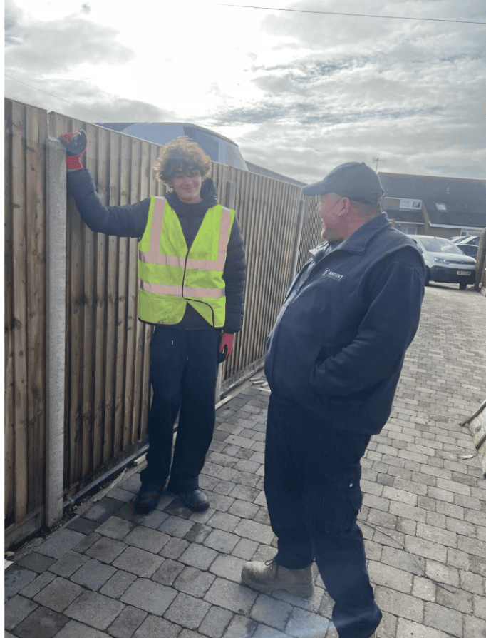 Work experience student Joey and Shane from Knight Fencing at a timber fencing site in Chichester