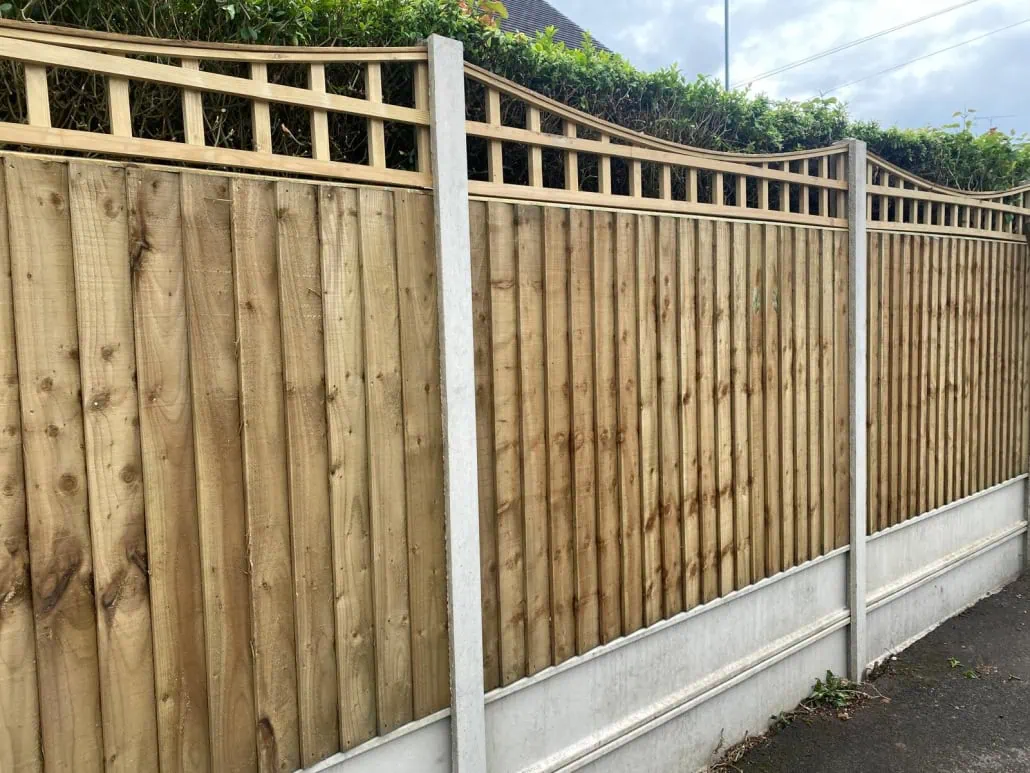 Trellis on closeboard fence panel with concrete gravel board