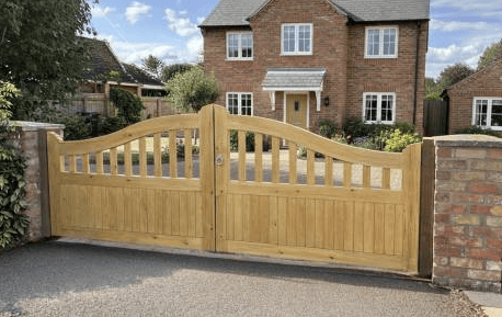 Bespoke Chidham timber entrance gates with attractive vertical panelling, custom-built by Knight Fencing for a perfect fit