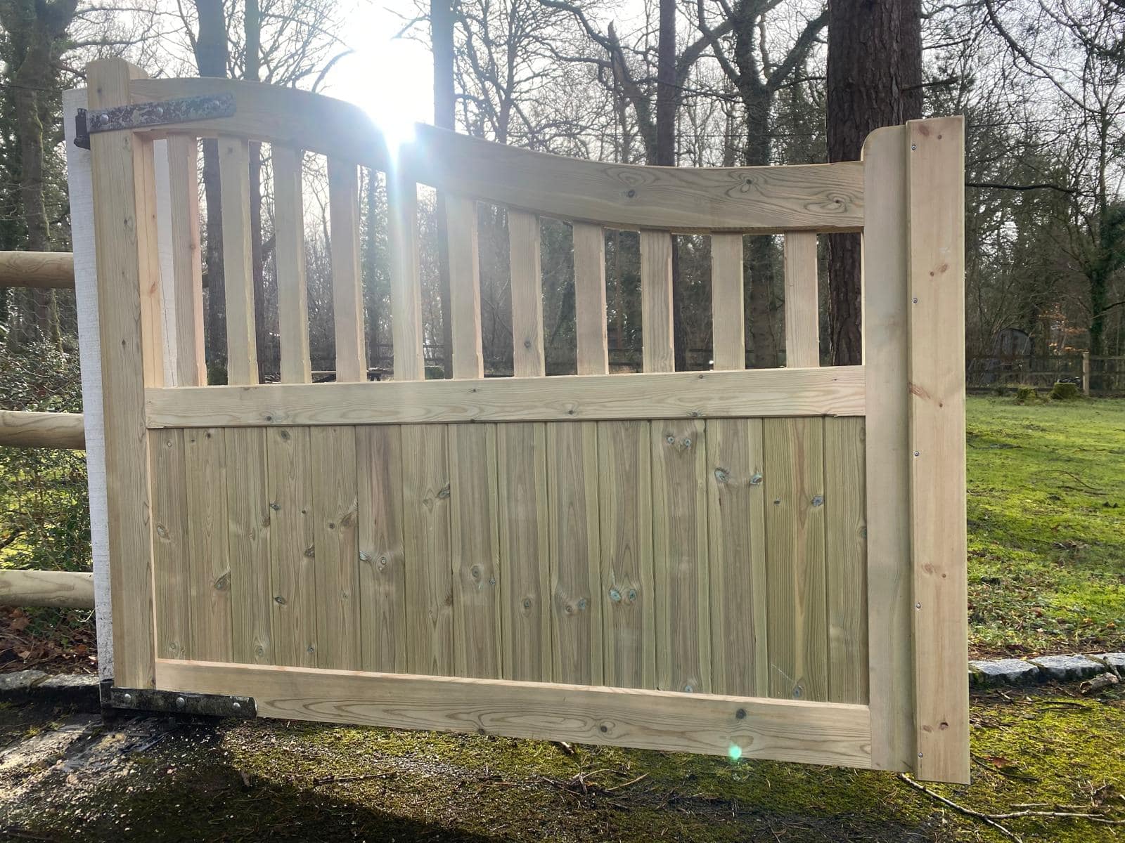 A durable timber Highleigh driveway gate leaf featuring a decorative open-top panel and heavy-duty frame by Knight Fencing