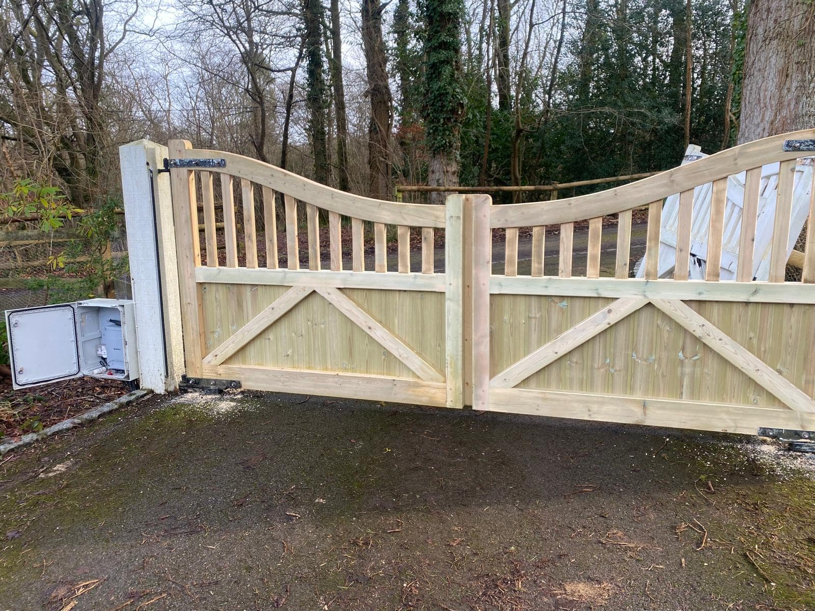 Interior view of Highleigh driveway gates showing heavy-duty diagonal bracing and a secure automated system control box.
