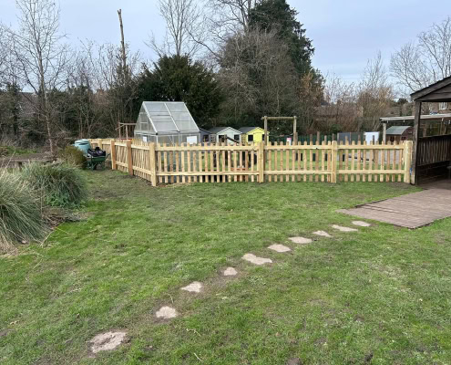 1000mm high timber picket fencing and matching gate installed at a primary school