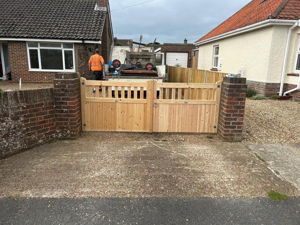 wooden goodwood driveway gates brick pillars